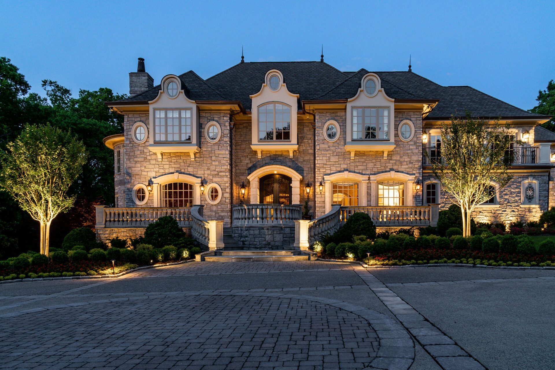 Outdoor lighting increasing the visual appeal and safety of a luxury home in Nashville, TN