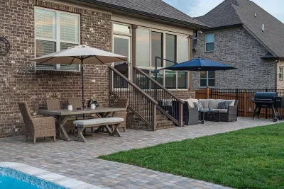 A spacious backyard with a swimming pool and a protective fence, creating a safe and inviting outdoor environment.