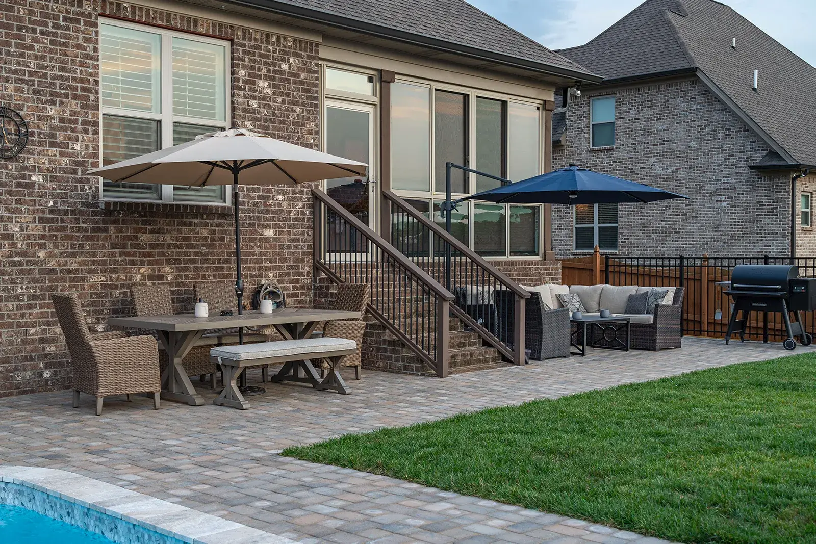 A spacious backyard with a swimming pool and a protective fence, creating a safe and inviting outdoor environment.