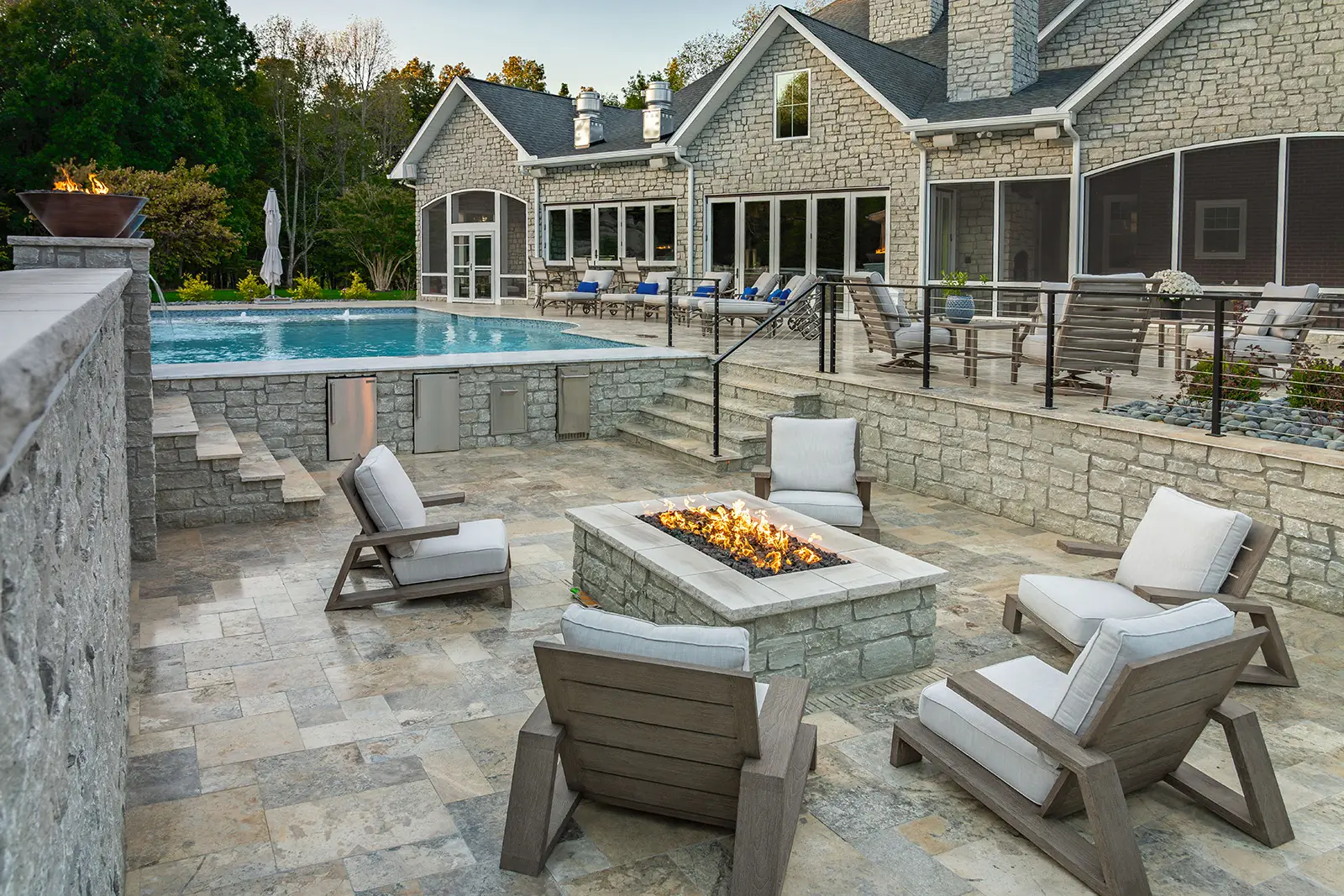A serene backyard scene showcasing a fire pit and inviting patio furniture, perfect for relaxing evenings outdoors.