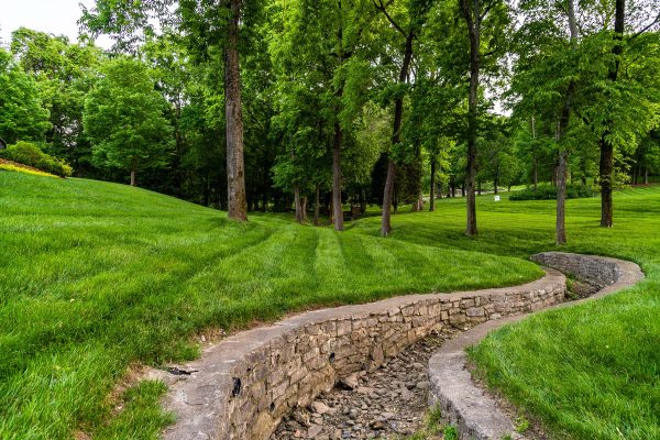 How Do Outdoor Living Contractors Handle Poor Soil or Erosion Issues?